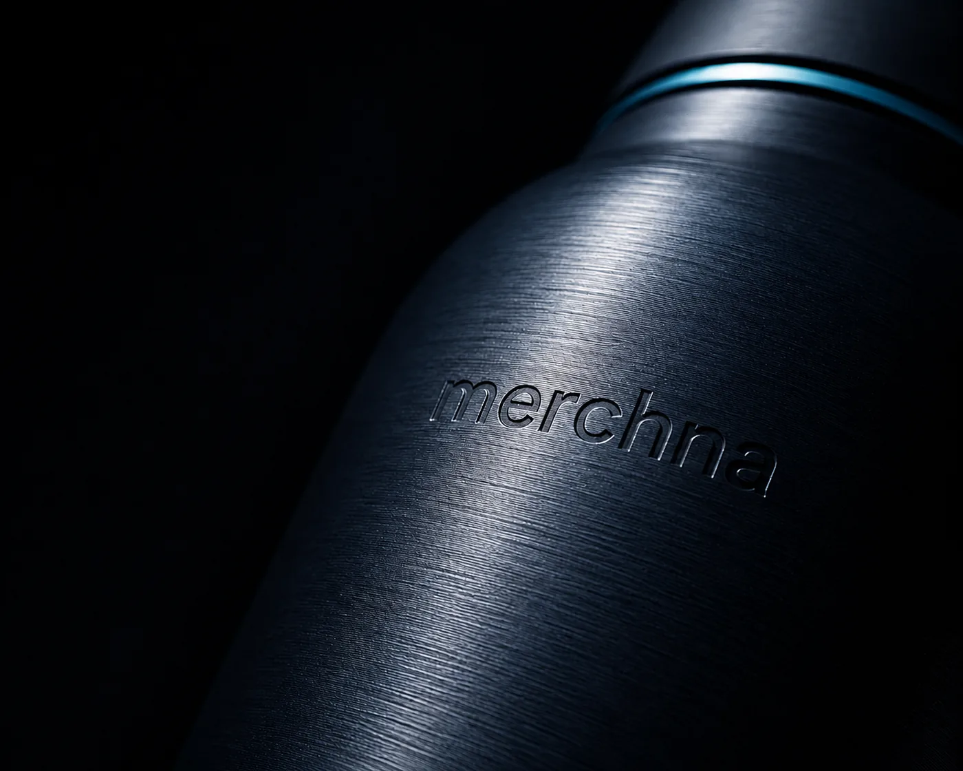 The merchna wordmark engraved into a brushed steel bottle